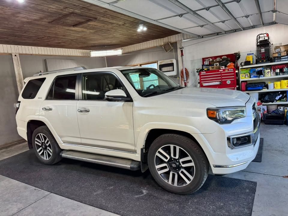 A white Toyota 4Runner detailed in the shop