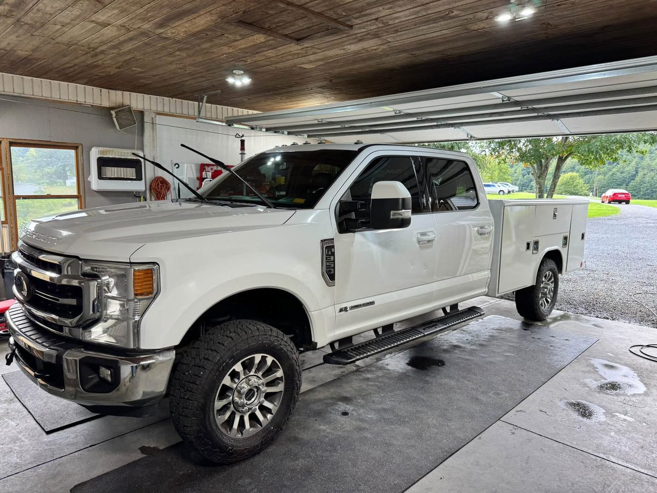 A white Ford F-250 service truck after a detail