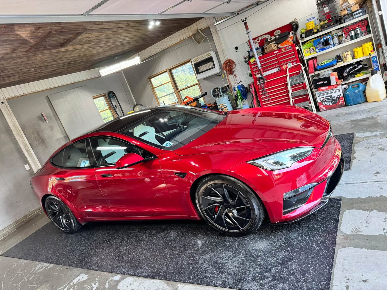 A red Tesla detailed to a mirror finish by New River Super Shine