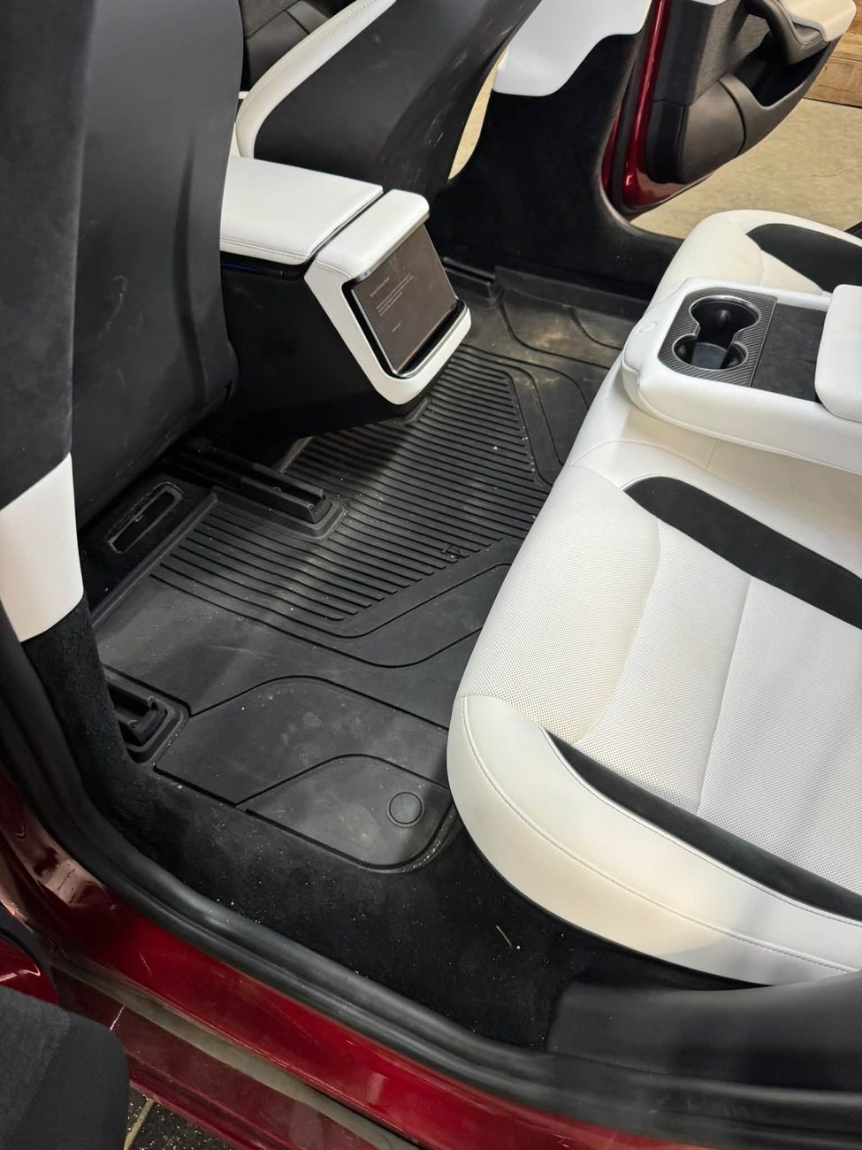The rear footwell and seats of a Tesla after cleaning