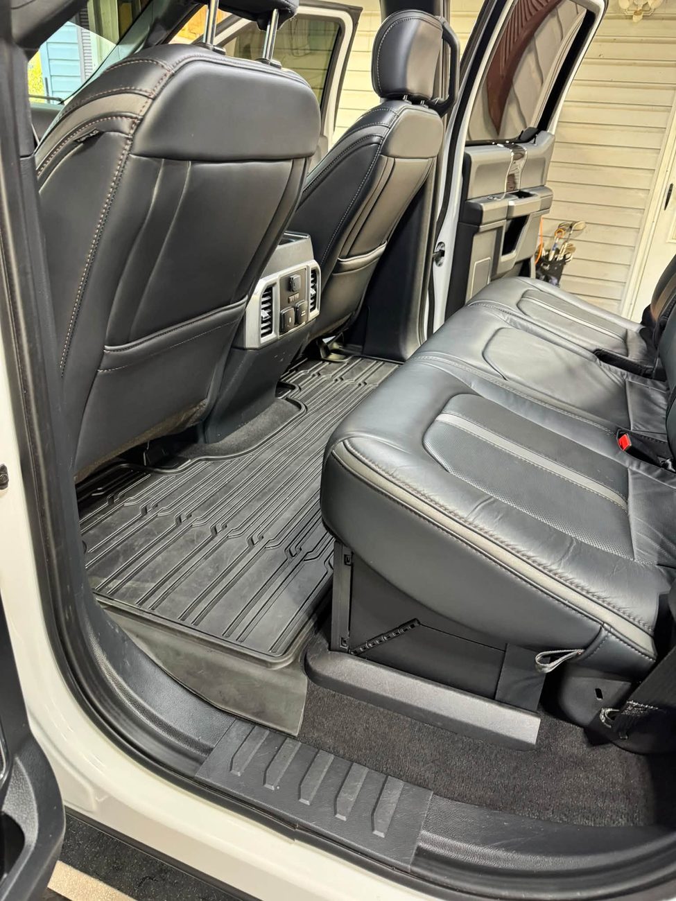 A truck's rear seats and floor cleaned down to the carpet